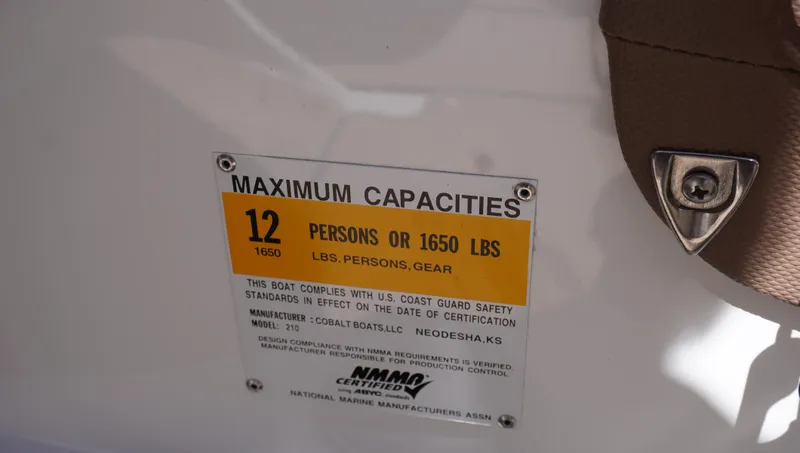 Slide: The Image of 2014 Cobalt 210 capacity plate: 12 persons or 1650 lbs maximum. - 29