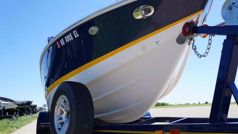 Slide: The Image of 2014 Cobalt 210 boat on trailer, side view, sunny day. - 3