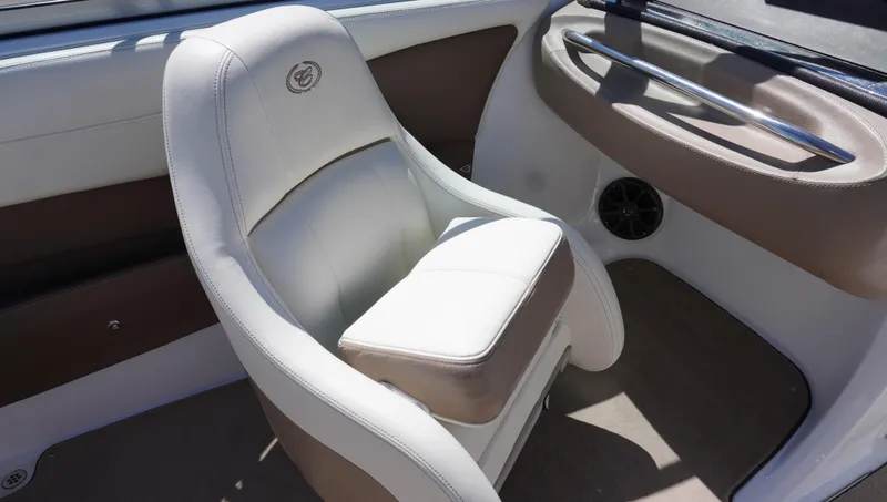 Slide: The Image of 2014 Cobalt 210 boat interior with white and brown seating. - 32