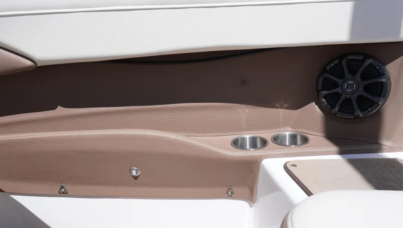 Slide: The Image of Interior of a 2014 Cobalt 210 boat with cup holders and speaker. - 39