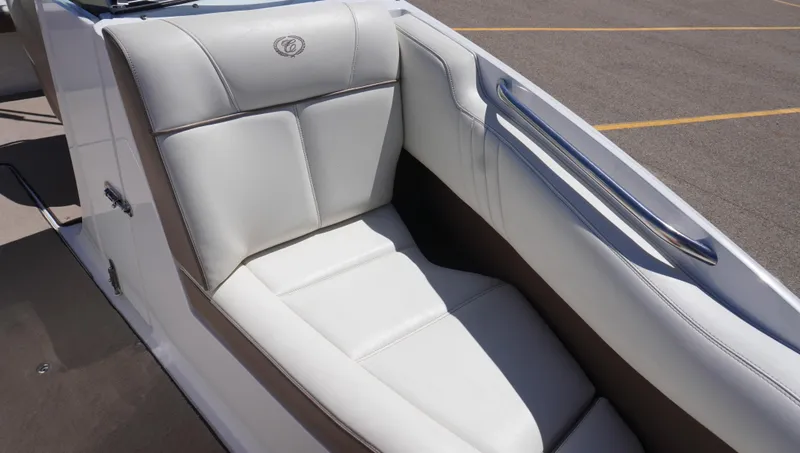 Slide: The Image of 2014 Cobalt 210 boat interior with white leather seating and sleek design. - 44