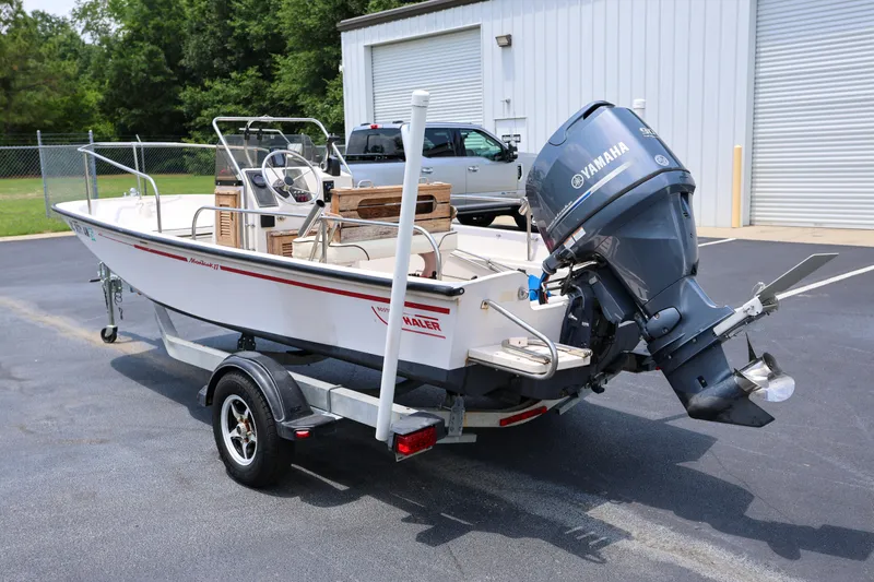 Slide: The Image of 1995 Boston Whaler 17 Montauk boat with Yamaha outboard motor on trailer. - 3