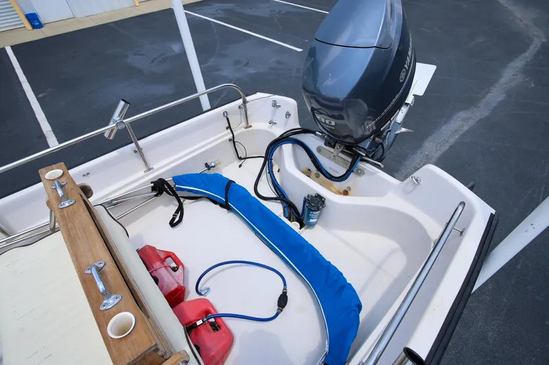 Slide: The Image of 1995 Boston Whaler 17 Montauk boat with Yamaha outboard motor and fuel tanks. - 5