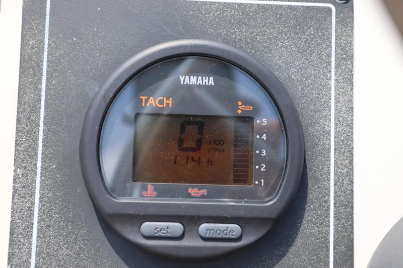 Slide: The Image of Yamaha tachometer on 1995 Boston Whaler 17 Montauk, displaying 114 hours. - 8