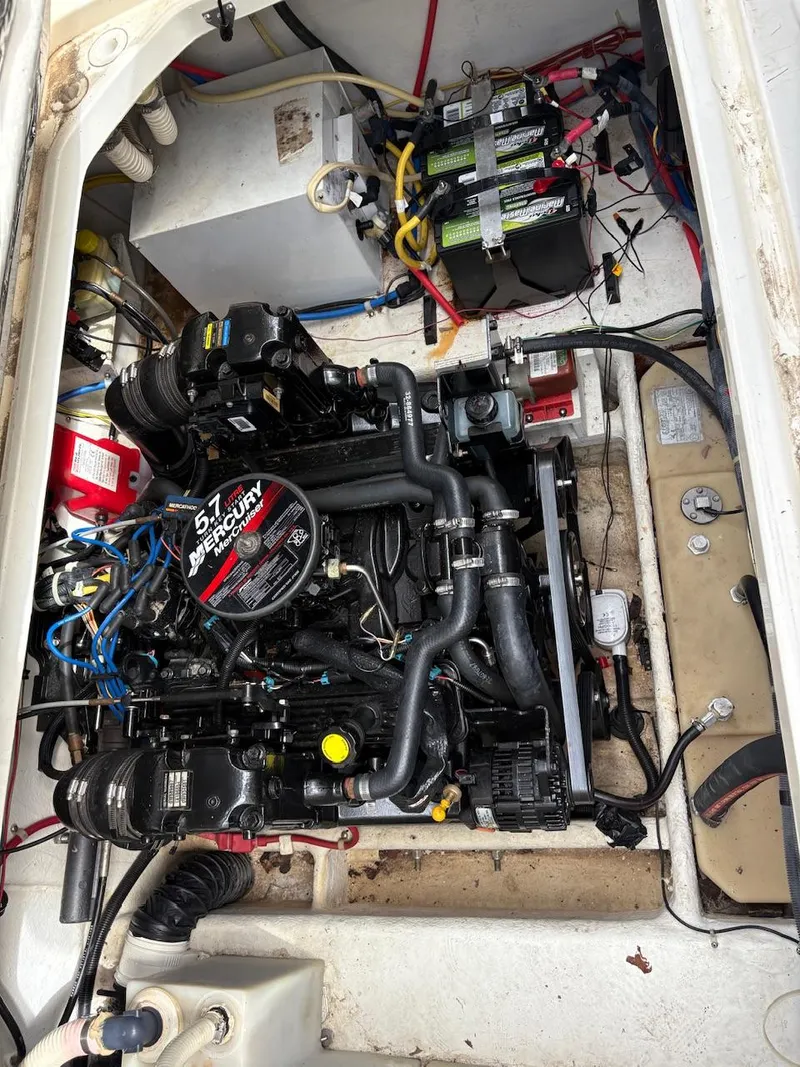Slide: The Image of Engine compartment of a 2007 Bayliner 245 Cruiser with a 5.7L MerCruiser engine. - 12