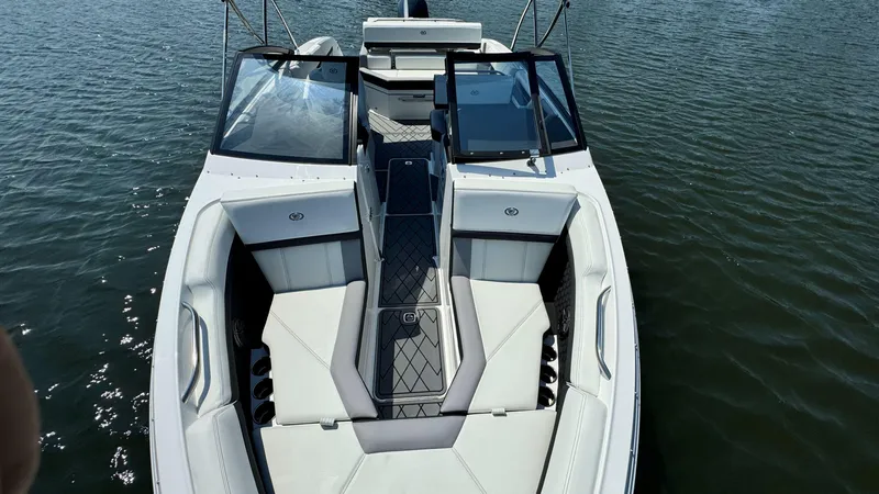 Slide: The Image of 2024 Cobalt R4 Outboard boat with sleek design on calm water. - 16