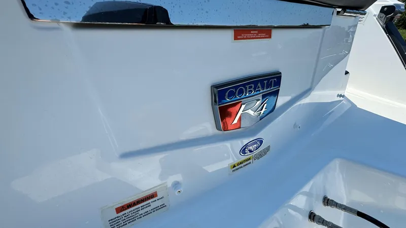 Slide: The Image of 2024 Cobalt R4 Outboard boat emblem on white surface, showcasing brand and model. - 20
