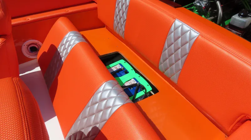 Slide: The Image of Orange and silver boat seat with battery compartment, Cigarette 20, 1979 model. - 13