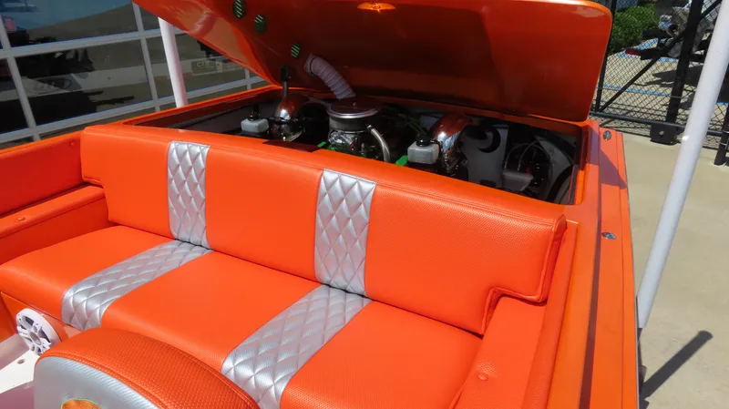 Slide: The Image of 1979 Cigarette 20 boat with orange and silver seating, engine compartment open. - 5