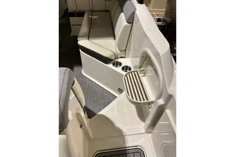 Slide: The Image of 2016 Sea Ray 270 Sundeck interior with seating and cup holders. - 14