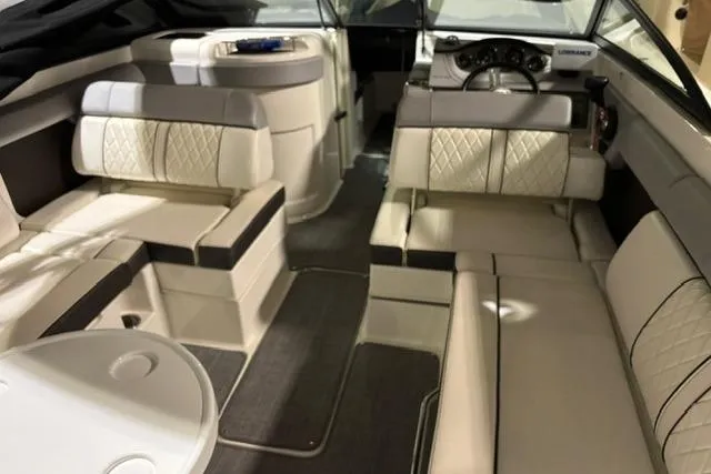 Slide: The Image of 2016 Sea Ray 270 Sundeck interior with plush seating and modern dashboard. - 18