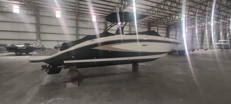Slide: The Image of 2016 Sea Ray 270 Sundeck boat in indoor storage facility. - 2