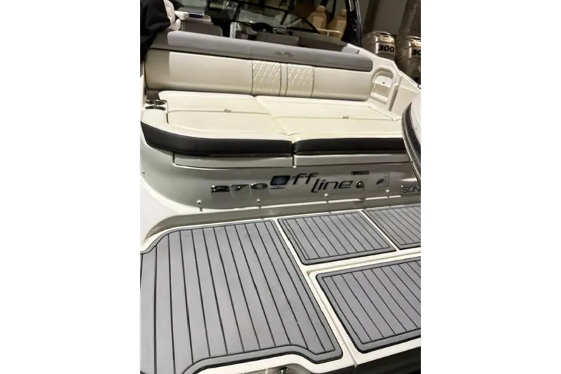 Slide: The Image of 2016 Sea Ray 270 Sundeck boat with cushioned seating and sleek deck design. - 21