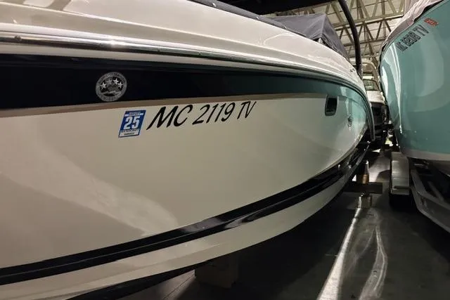 Slide: The Image of 2016 Sea Ray 270 Sundeck boat in storage, registration number visible. - 23