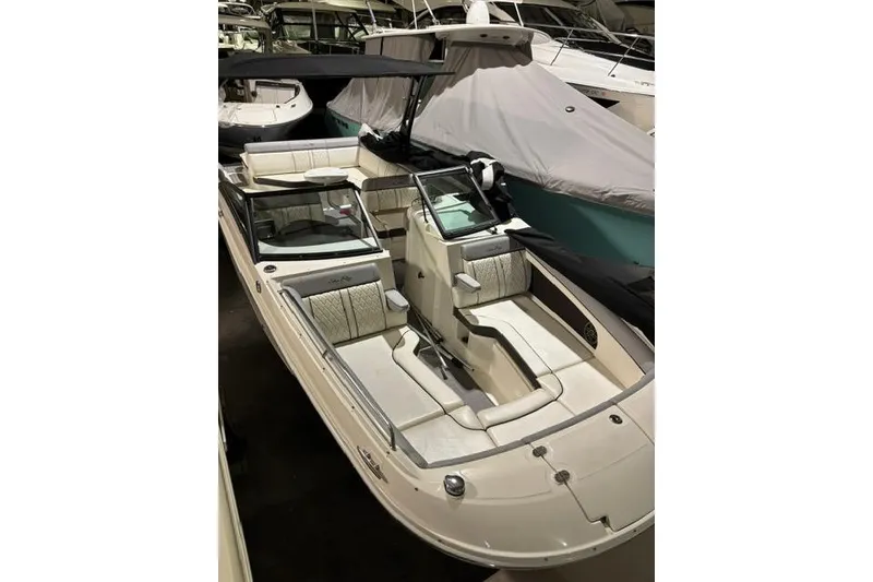 Slide: The Image of 2016 Sea Ray 270 Sundeck boat with spacious seating and sleek design. - 24