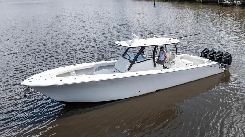Slide: The Image of 2023 Front Runner 39 Center Console boat on calm water. - 13