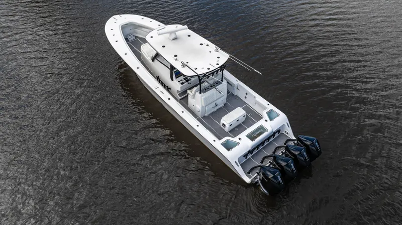 Slide: The Image of 2023 Front Runner 39 Center Console boat on water, featuring four powerful outboard engines. - 8