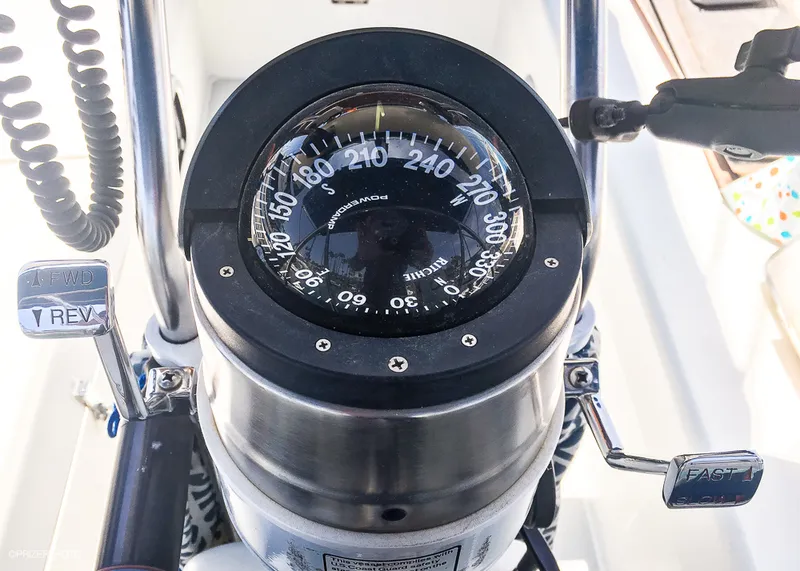 Slide: The Image of Compass and controls on a 1994 Catalina 320 sailboat. - 13