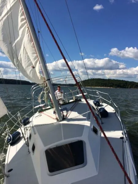Slide: The Image of Sailing on a 1994 Catalina 320 yacht under a clear blue sky. - 3