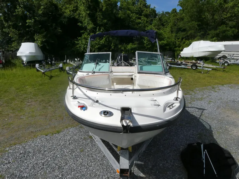 Slide: The Image of 2005 Boston Whaler 210 Ventura boat on trailer, parked outdoors. - 2