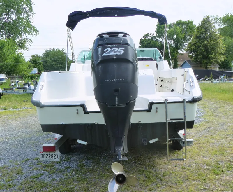 Slide: The Image of 2005 Boston Whaler 210 Ventura boat with outboard motor, rear view. - 4