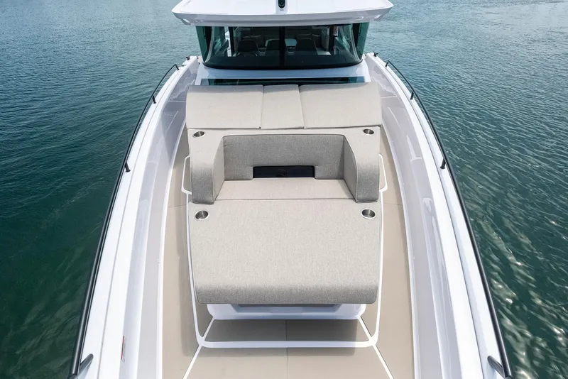 Slide: The Image of 2023 Axopar 45 Cross Cabin boat with spacious deck and comfortable seating. - 11