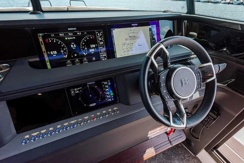 Slide: The Image of 2023 Axopar 45 Cross Cabin dashboard with advanced navigation and control systems. - 17