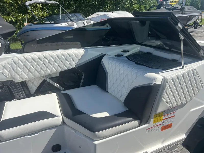Slide: The Image of 2024 Tigé 22RZX boat interior with diamond-stitched seating and modern design. - 10