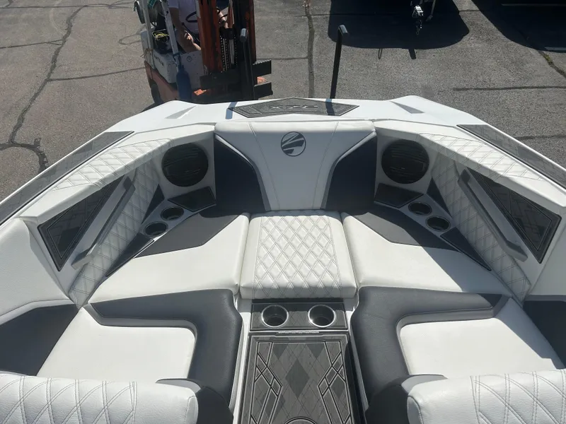 Slide: The Image of 2024 Tigé 22RZX boat interior with luxurious seating and cup holders. - 11