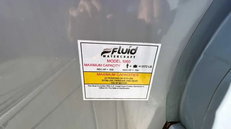 Slide: The Image of Sticker on Fluid Watercraft M35, 2023 model, showing maximum capacity and safety information. - 21
