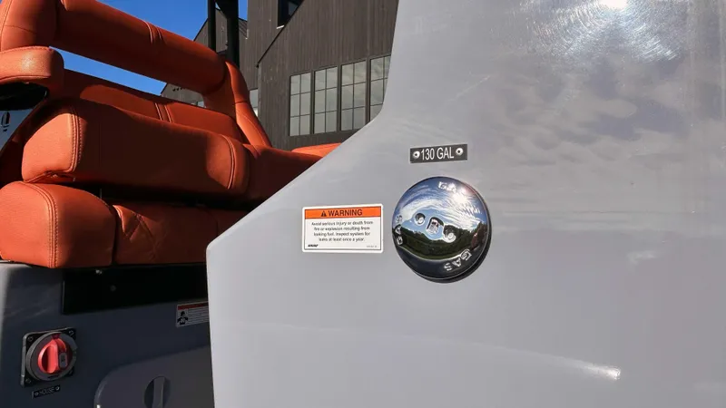 Slide: The Image of 2023 Fluid Watercraft M35 boat with orange seats and fuel cap, 130-gallon capacity. - 22