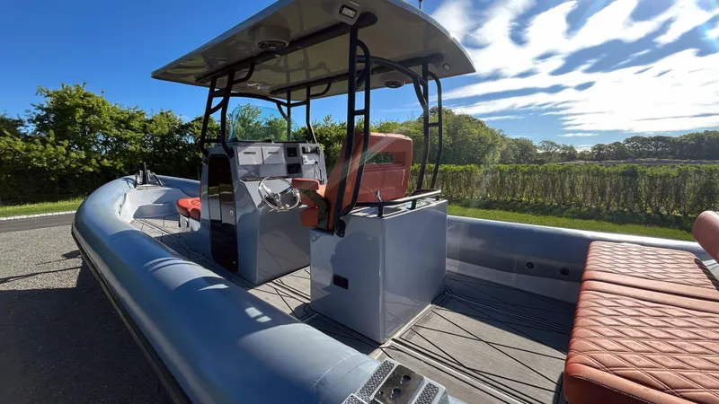 Slide: The Image of 2023 Fluid Watercraft M35 boat with modern design and spacious seating. - 28