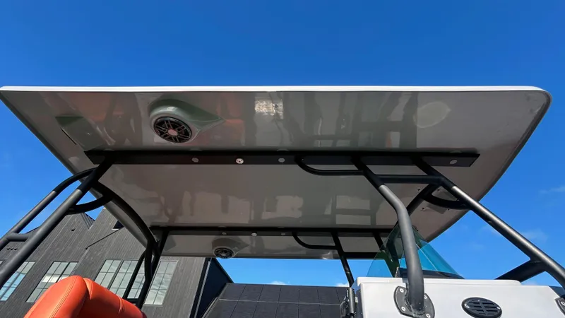 Slide: The Image of 2023 Fluid Watercraft M35 boat canopy against clear blue sky. - 30