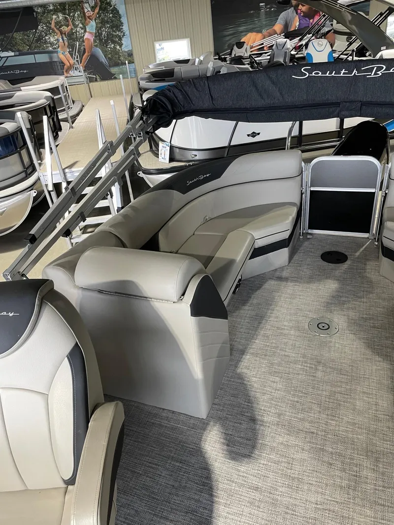 Slide: The Image of 2023 South Bay 224RS LE pontoon boat interior with plush seating and modern design. - 6