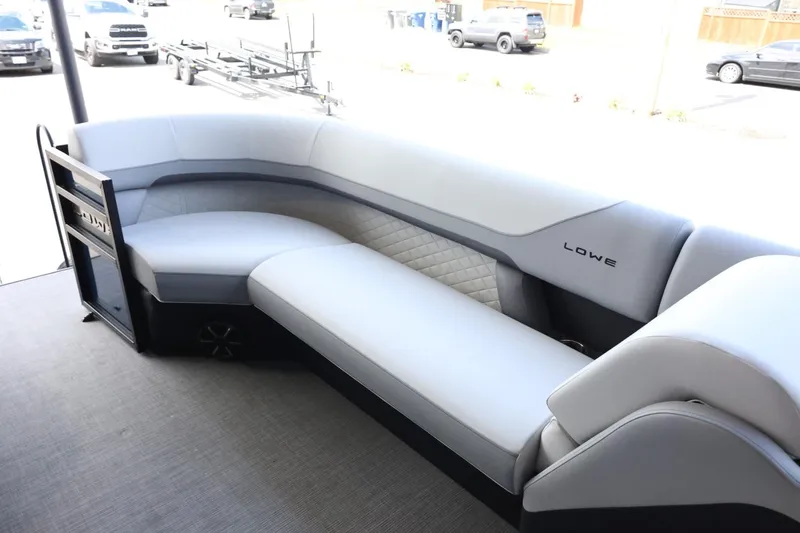 Slide: The Image of 2025 Lowe SS 230 DL boat interior with sleek, modern seating design. - 10