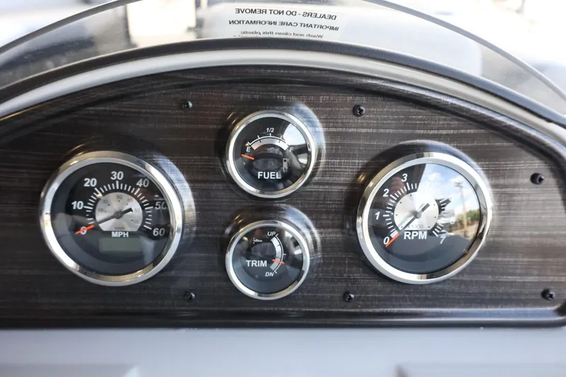Slide: The Image of Dashboard of 2025 Lowe SS 230 DL boat with speedometer, fuel, trim, and RPM gauges. - 15
