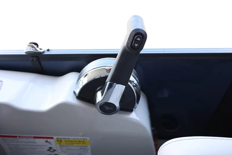 Slide: The Image of Throttle control of 2025 Lowe SS 230 DL boat, featuring sleek design and ergonomic handle. - 19
