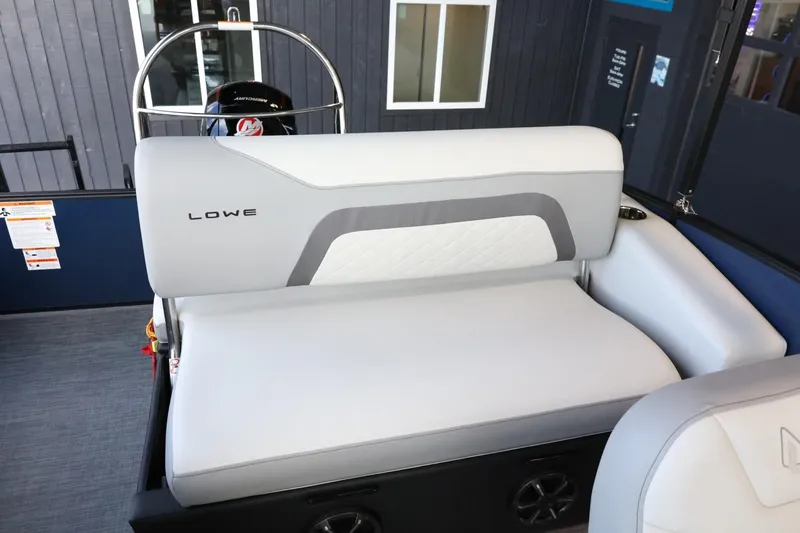 Slide: The Image of 2025 Lowe SS 230 DL boat interior with gray seating and modern design. - 21