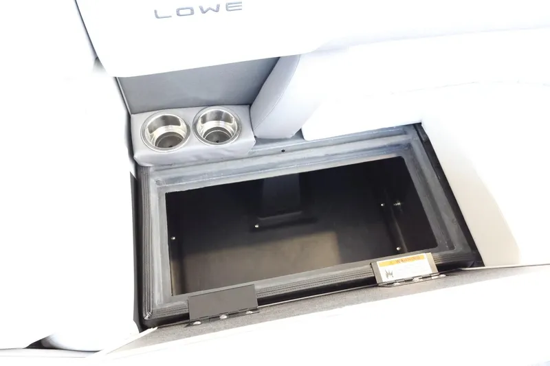 Slide: The Image of Open storage compartment with cup holders in 2025 Lowe SS 230 DL boat. - 28