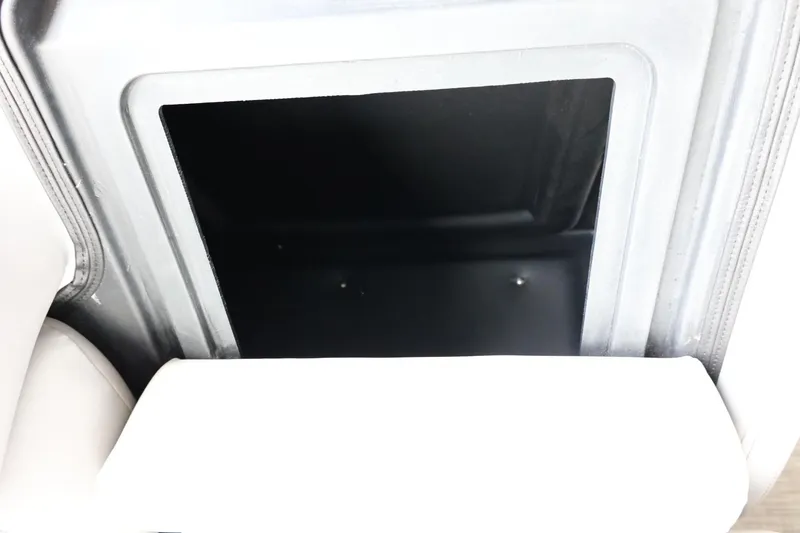 Slide: The Image of Storage compartment in 2025 Lowe SS 230 DL boat interior. - 32