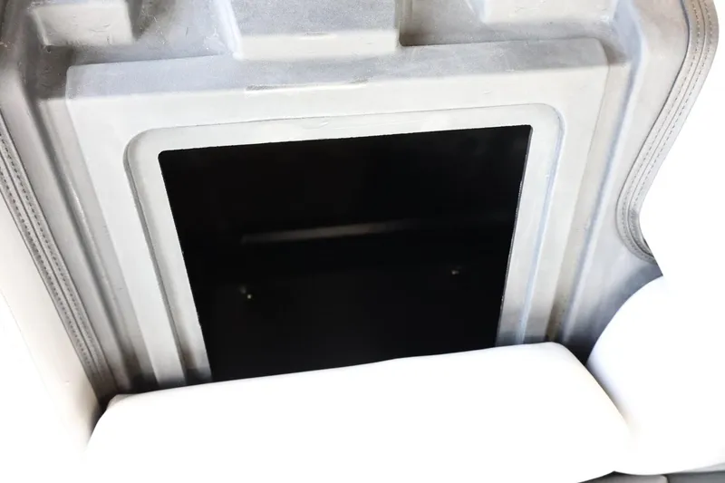 Slide: The Image of Interior view of 2025 Lowe SS 230 DL boat storage compartment. - 33
