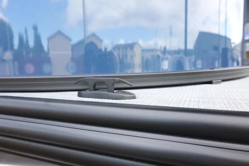 Slide: The Image of Close-up of 2025 Lowe SS 230 DL boat cleat against a reflective surface. - 38