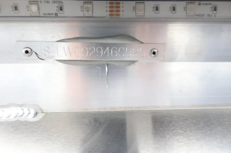 Slide: The Image of 2025 Lowe SS 230 DL boat identification plate on metallic surface. - 41