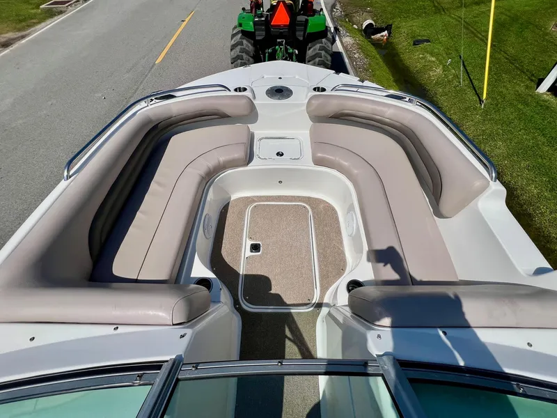 Slide: The Image of 2013 Hurricane SunDeck 217 OB boat with spacious seating and sleek design. - 14