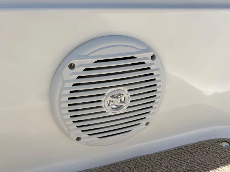 Slide: The Image of Speaker on 2013 Hurricane SunDeck 217 OB boat, mounted on white surface. - 19