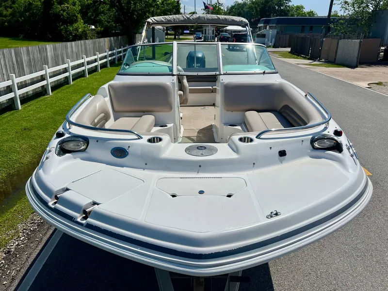 Slide: The Image of 2013 Hurricane SunDeck 217 OB boat with spacious seating and sleek design. - 6