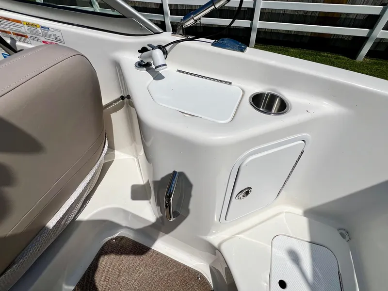 Slide: The Image of 2013 Hurricane SunDeck 217 OB boat interior with sink and storage compartments. - 9