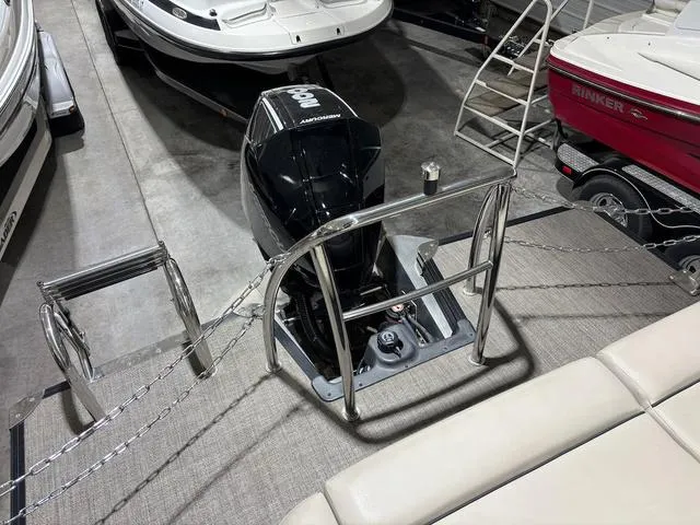 Slide: The Image of 2021 Barletta C24UC pontoon boat with outboard motor in showroom. - 8