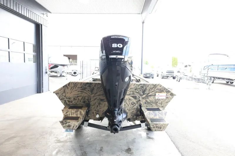 Slide: The Image of 2023 Lowe Roughneck 1760 Pathfinder boat with camo design and 80 HP outboard motor. - 7