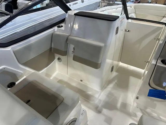 Slide: The Image of 2025 Boston Whaler 210 Vantage interior with seating and storage compartments. - 3